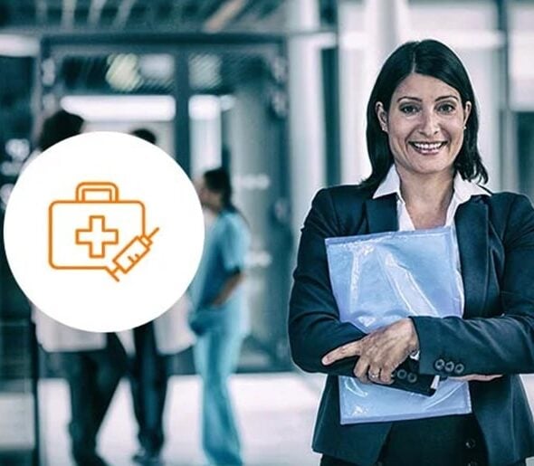 Professional woman in business attire holding documents, standing confidently in a healthcare setting with a medical icon overlay, symbolizing the intersection of business and healthcare management