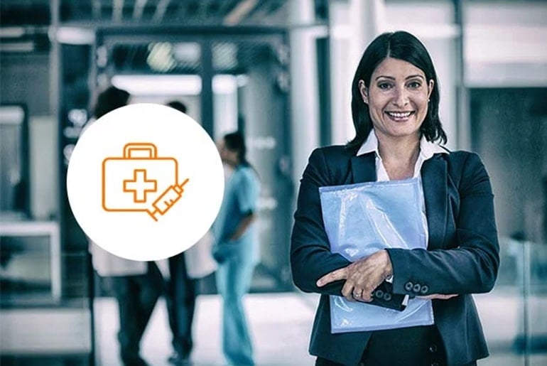 Professional woman in business attire holding documents, standing confidently in a healthcare setting with a medical icon overlay, symbolizing the intersection of business and healthcare management